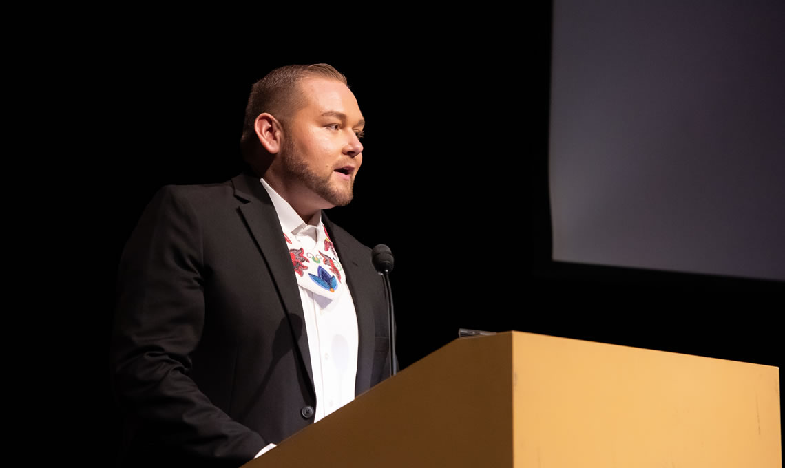 Will Miller speaking at the NAYA Gala in 2022